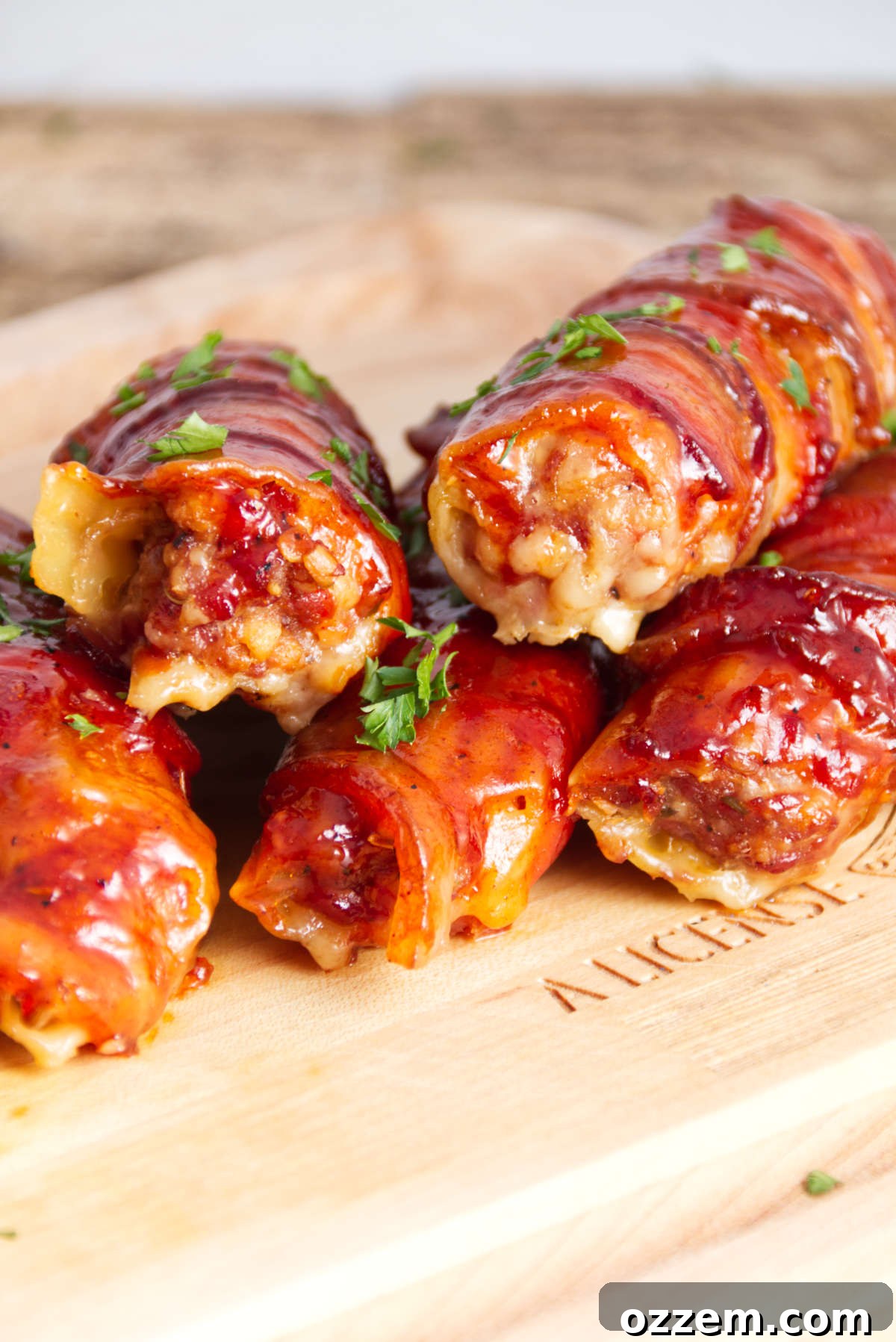 manicotti shells stuffed with sausage and wrapped in bacon and bbq sauce
