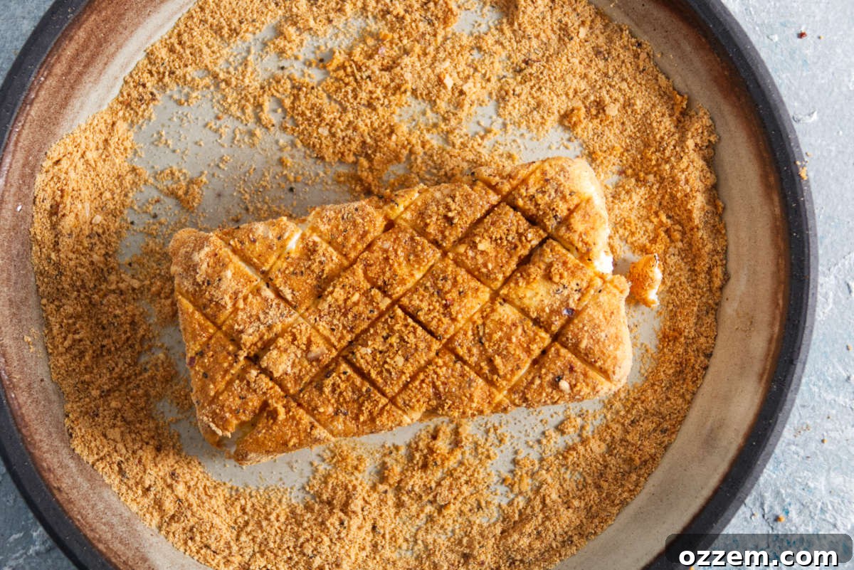 Decadent Smoked Cream Cheese 4 cream cheese being coated in bbq seasoning