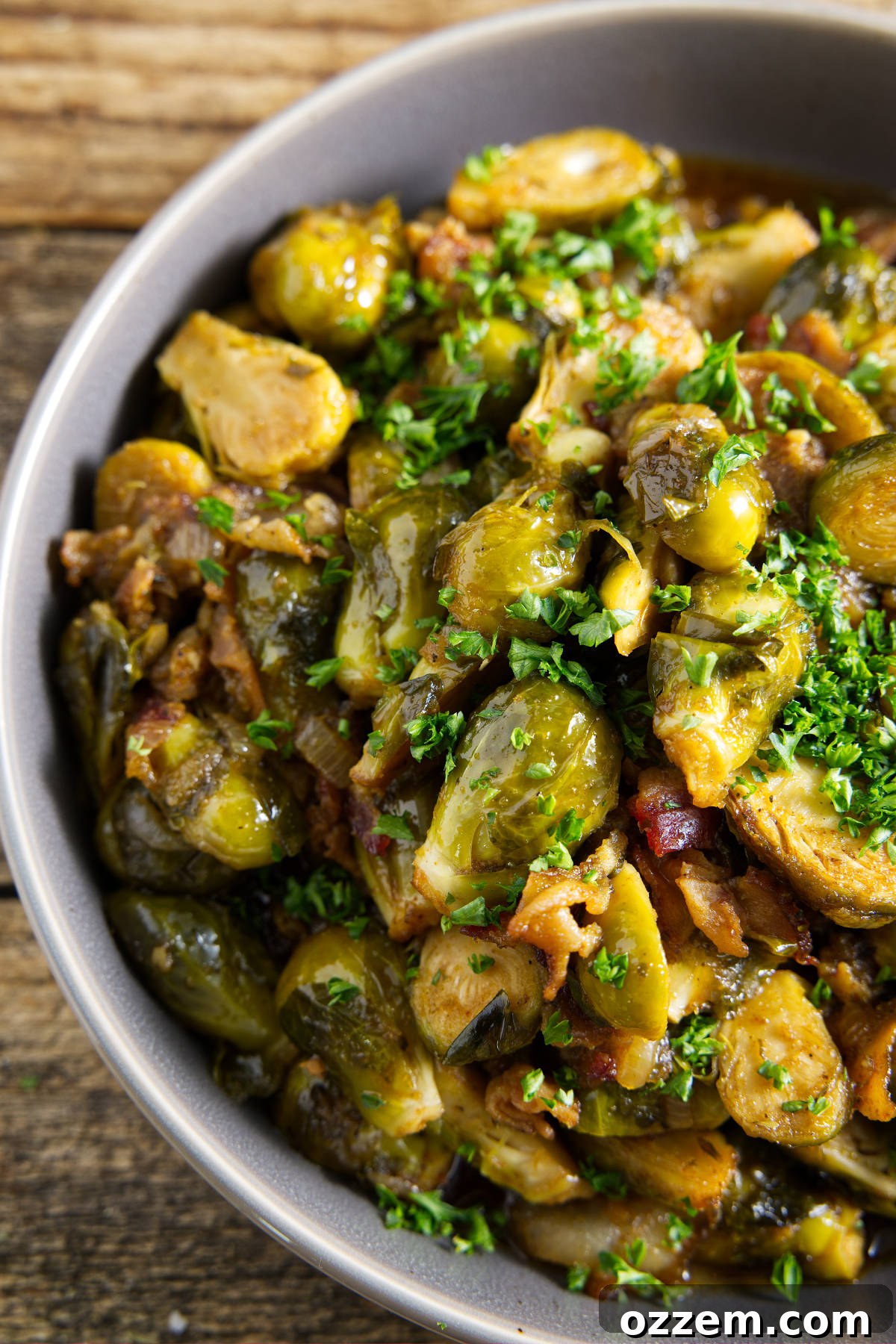 Smoked Brussels sprouts with crispy bacon in a rustic bowl, ready to serve at a barbecue