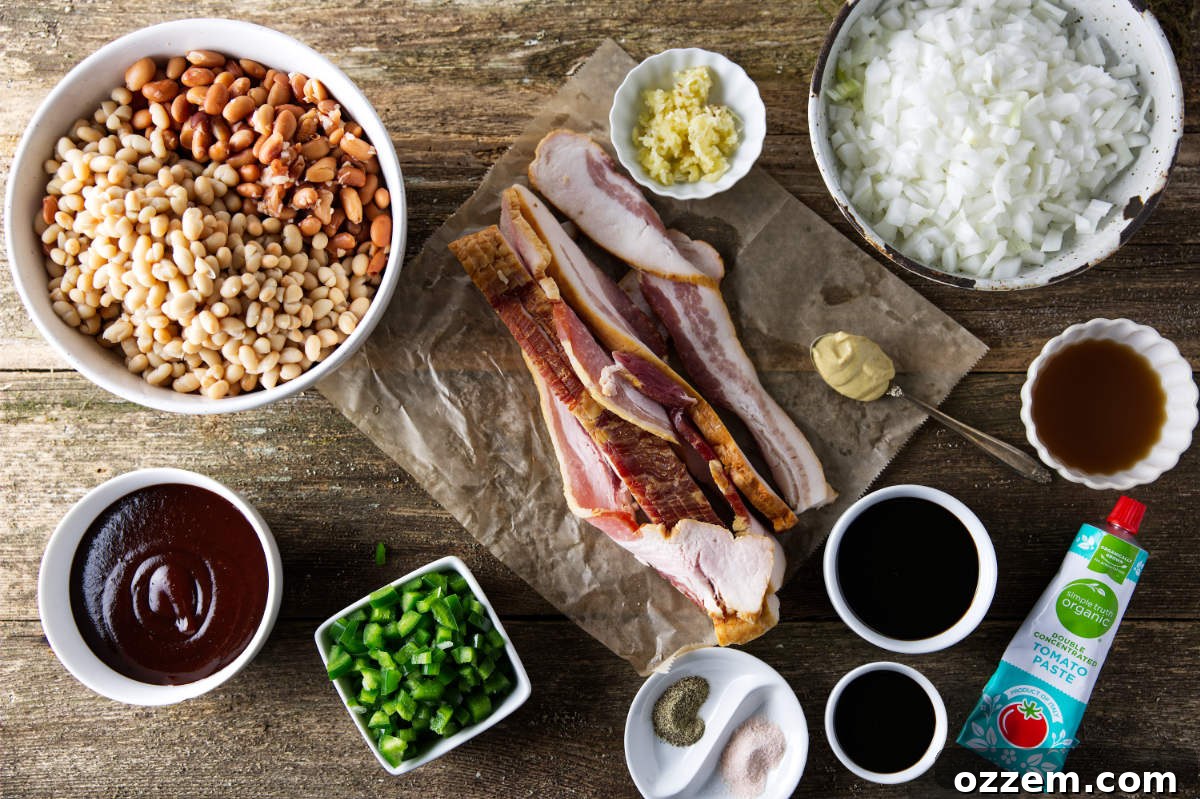Pitmaster's Baked Beans 4 All the ingredients for Traeger smoked baked beans laid out on a rustic wooden surface, including canned beans, bacon, onions, jalapeños, and sauces.