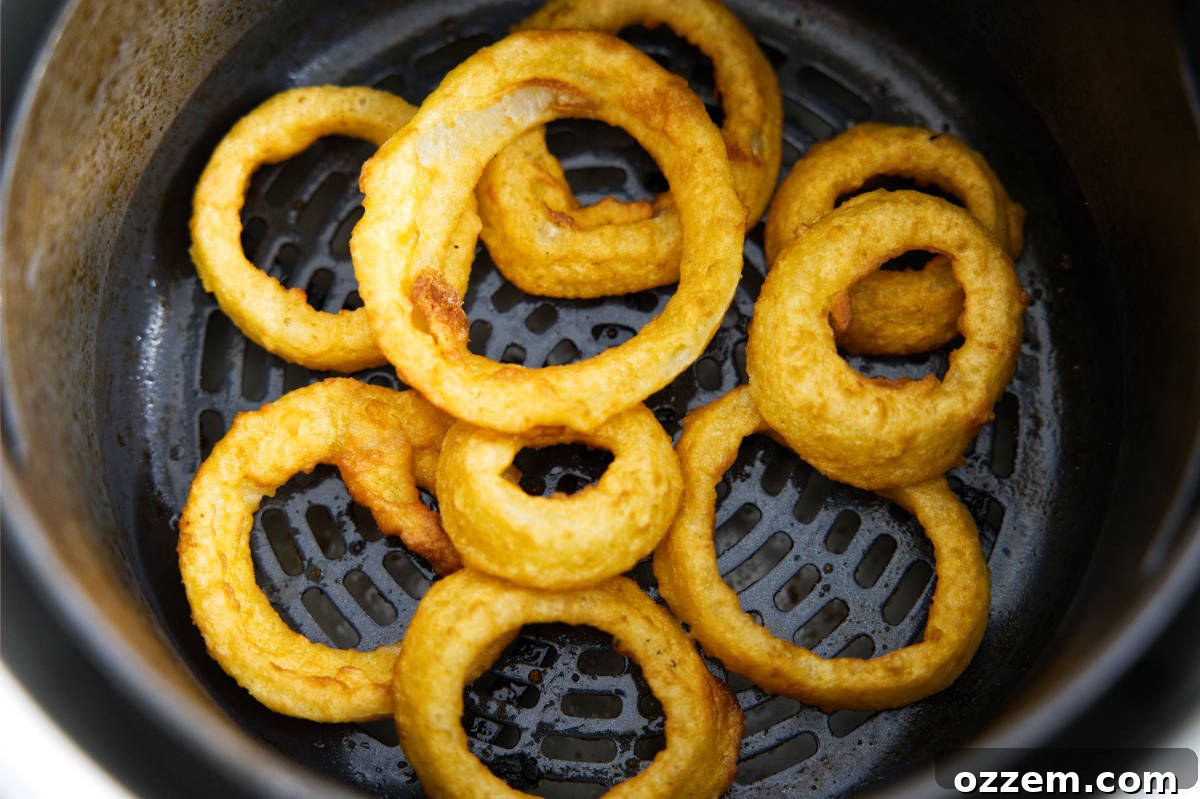 Crispy Air Fryer Frozen Onion Rings 4 Onion rings in the air fryer basket