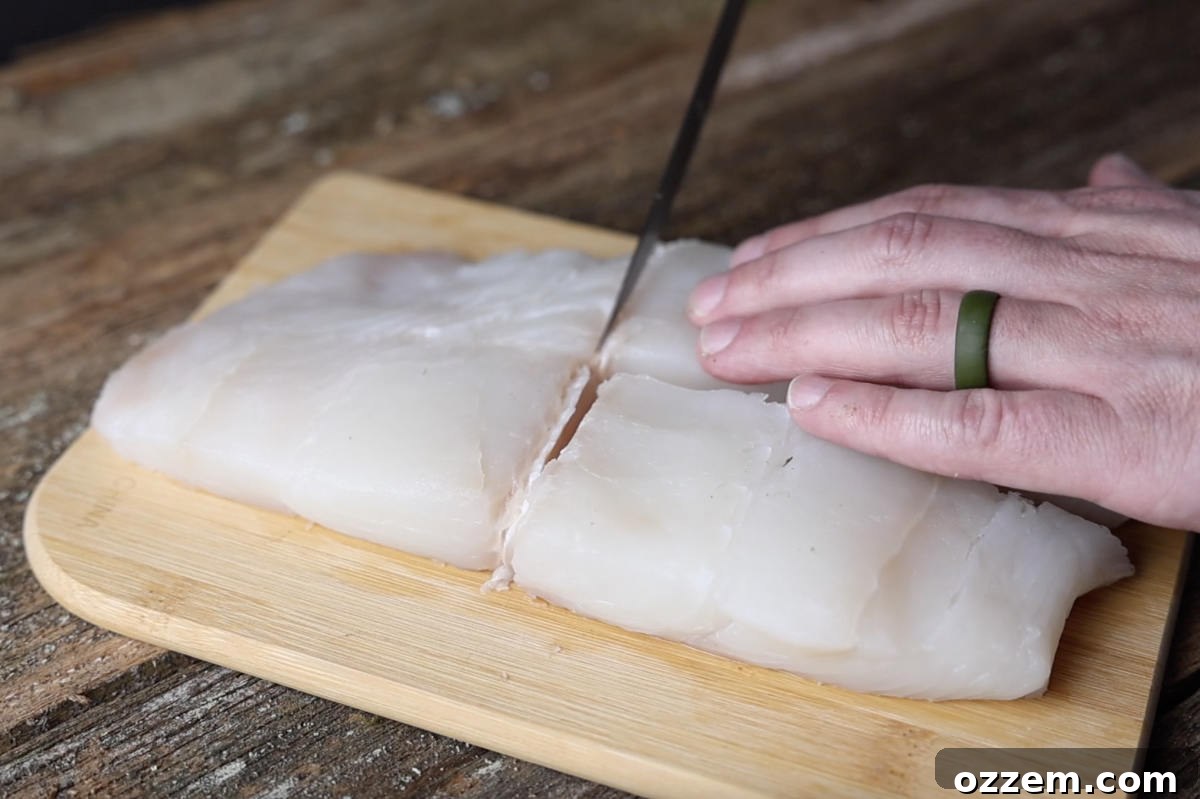 cutting halibut fillet into portions