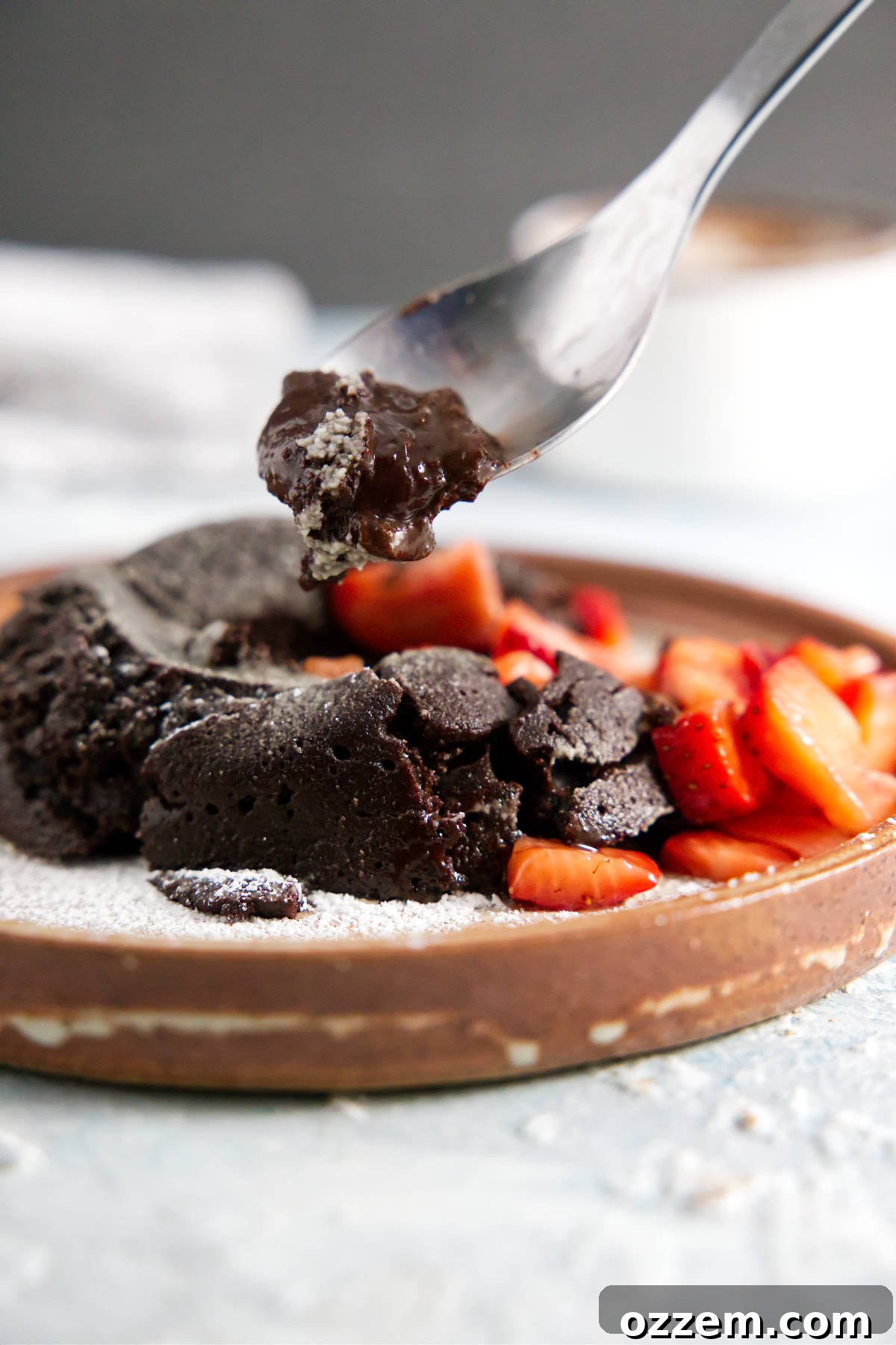 Spoonful of chocolate lava cake with gooey ganache center.