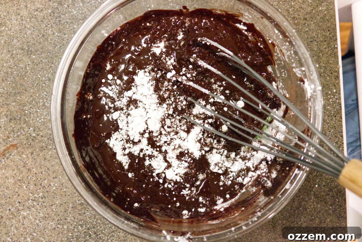 Mixing together ingredients for chocolate lava cake.