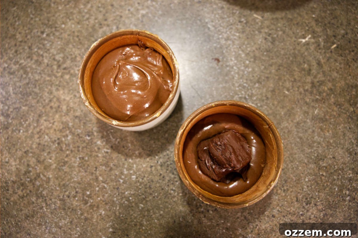Chocolate mug cakes with ganache spooned into center.