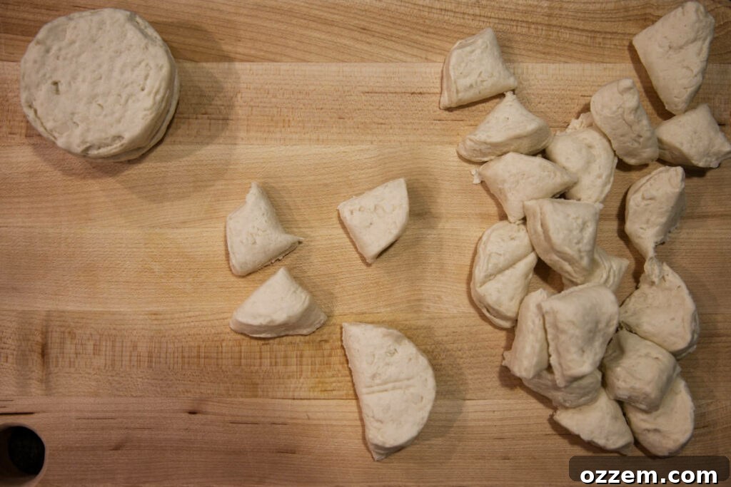 Golden Air Fryer Doughnut Bites 6 cutting biscuit dough into quarters