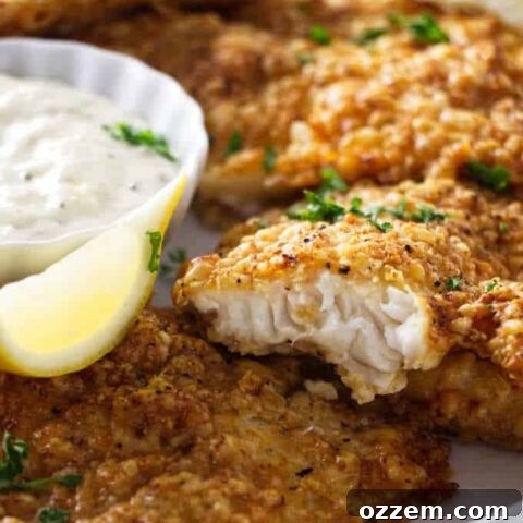 close up shot of air fryer tilapia showing the flaky fish