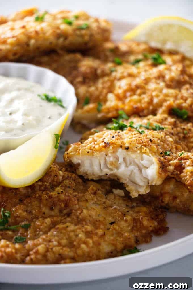 close up shot of air fryer tilapia showing the flaky fish