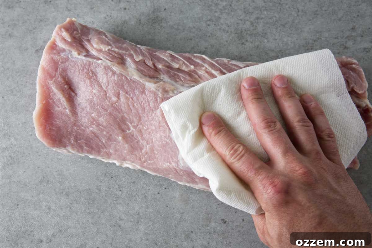 patting dry a pork loin
