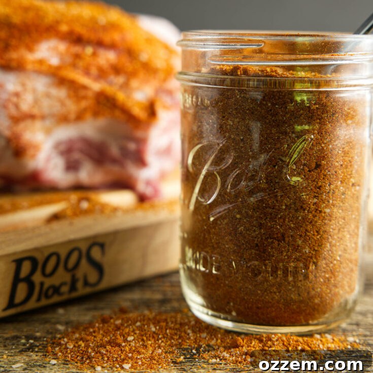 A mason jar full of homemade pork dry rub, ready for use.