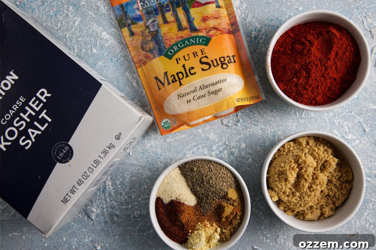 An array of fresh and vibrant spices laid out on a clean wooden surface, illustrating the ingredients required for the pork dry rub recipe.