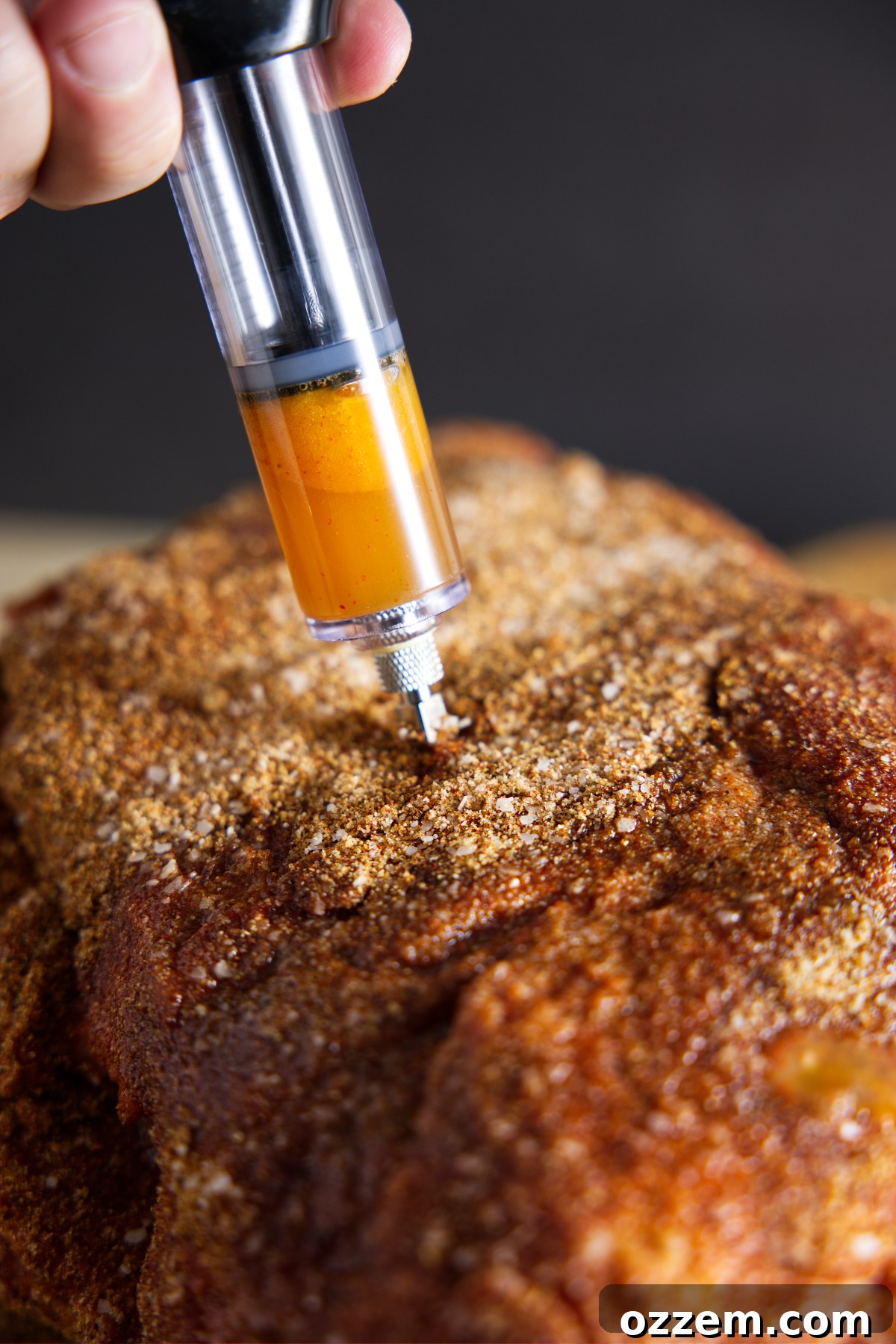 Unlock Juicier Pork Your Guide to Boston Butt Injection 6 Injecting marinade into seasoned meat.