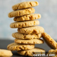 Large stack of air fryer peanut butter cookies, perfectly baked and golden.