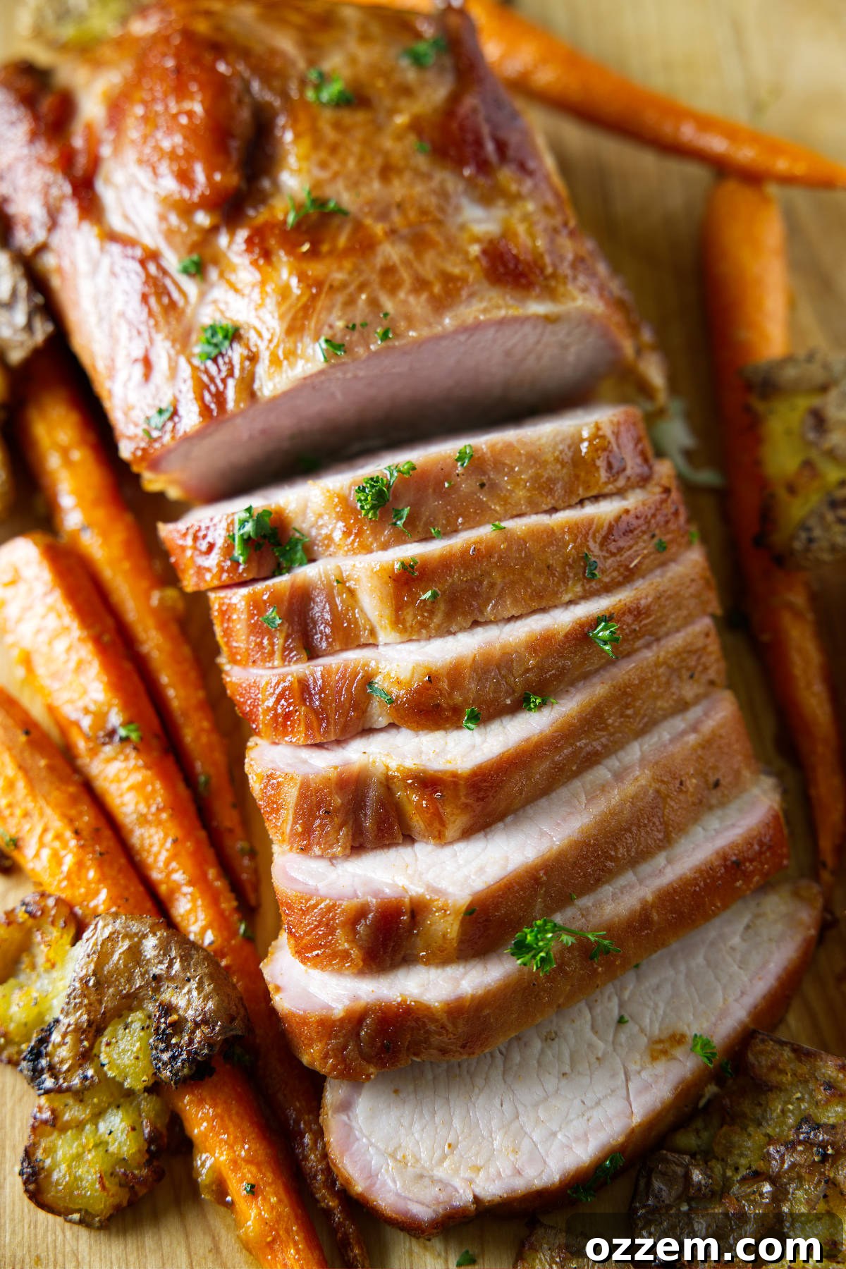 sliced whole smoked pork loin on cutting board