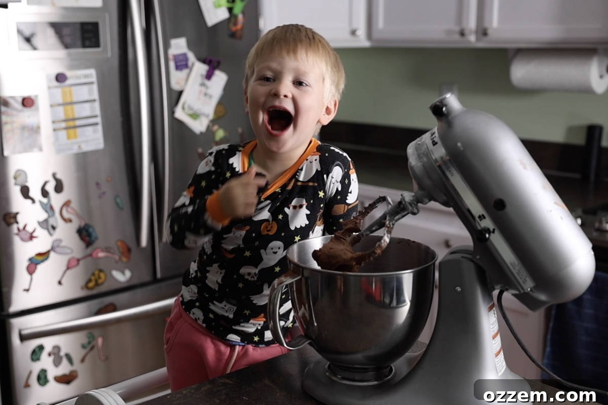 Mixing chocolate butter cream in a stand mixer.