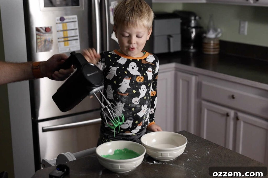 Mixing color in the royal icing.