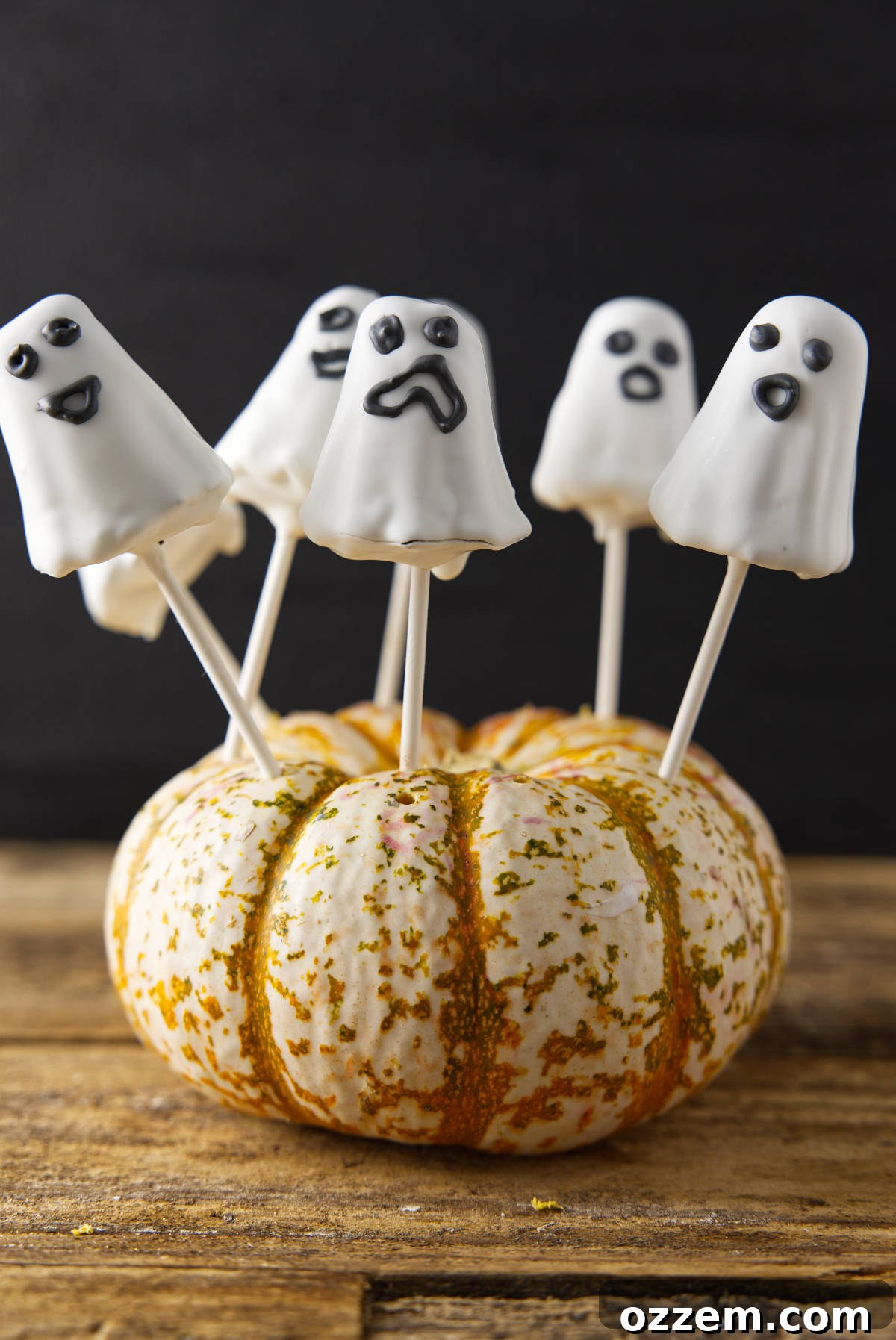 Ghost cake pops in pumpkin.