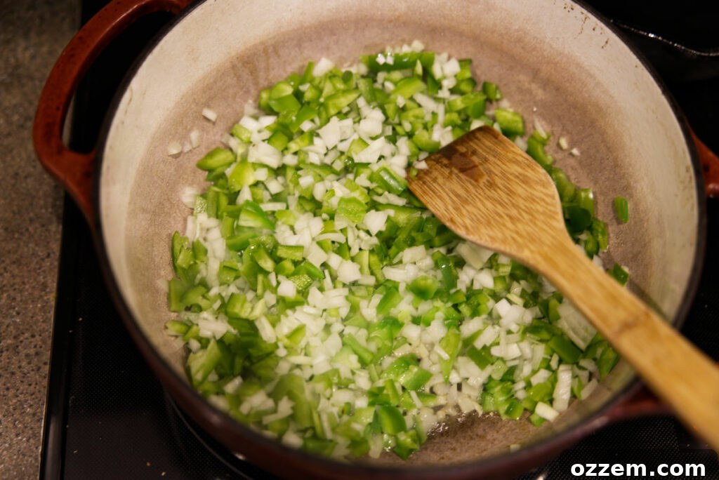 Smoky Leftover Turkey Chili 4 Sauteing onions and green bell pepper in a Dutch oven.