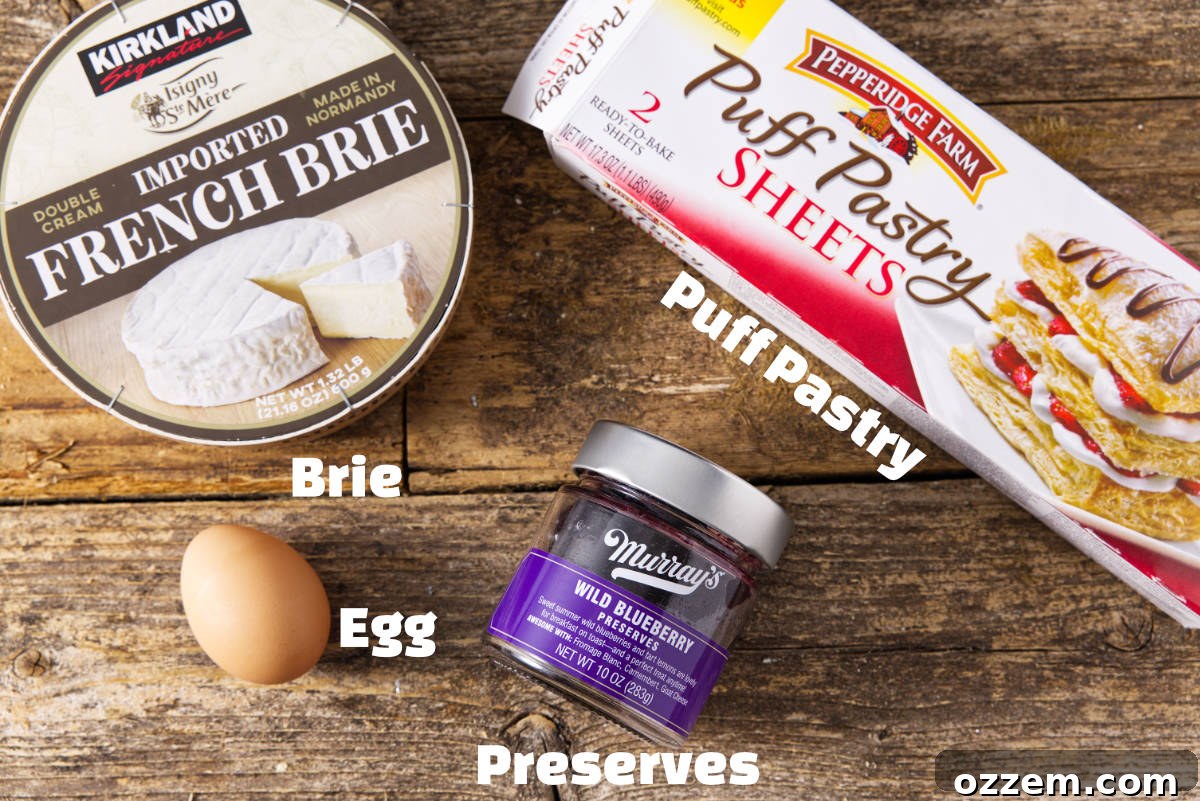 All the essential ingredients for making air fryer baked brie, neatly arranged for preparation.
