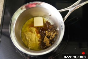 Smoky Traeger Stuffed Chicken Legs 14 Ingredients for a glaze in a sauce pan on the stove.