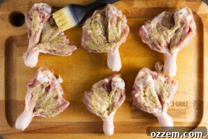 Smoky Traeger Stuffed Chicken Legs 10 Brushing butterflied chicken legs with dijon mustard.