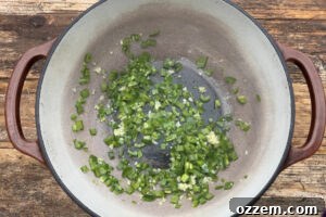 Diced jalapeño peppers in dutch oven.