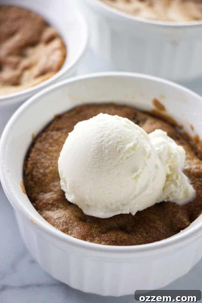 Deep dish cookie bowl baked in the air fryer, golden brown and ready for ice cream.