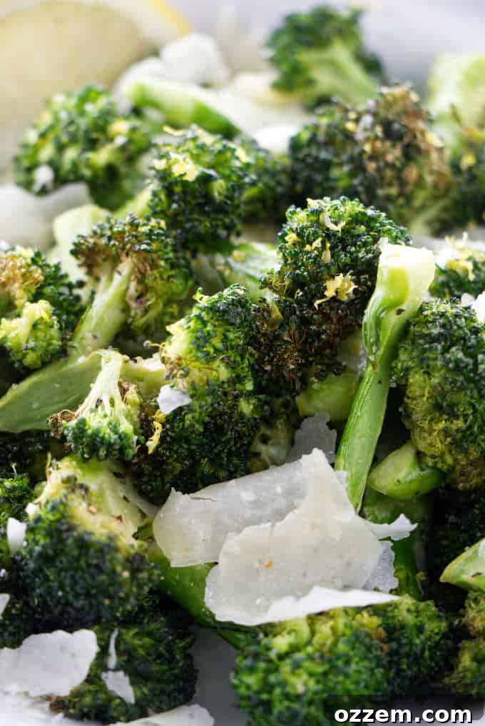 Crispy Lemon Parmesan Air Fryer Broccoli 2 Close up of perfectly cooked crispy air fryer broccoli with parmesan and lemon, ready to serve.