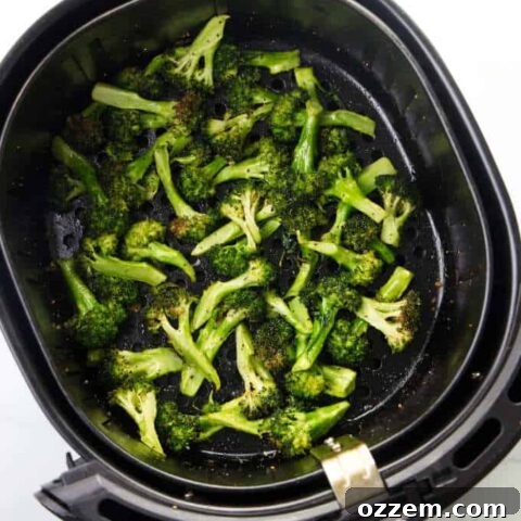 Crispy Air Fryer Broccoli with Parmesan and Lemon in a bowl.
