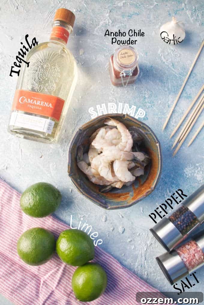 Close-up shot of key ingredients for tequila lime shrimp: garlic, ancho chile powder, black pepper, salt, and bamboo skewers, artfully arranged on a red and white napkin