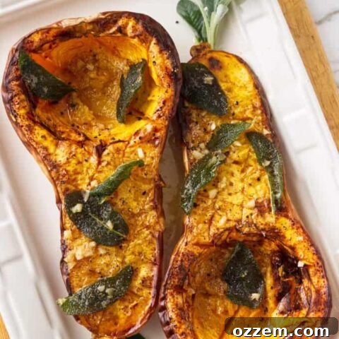 Two halves of a butternut squash on a serving plate.