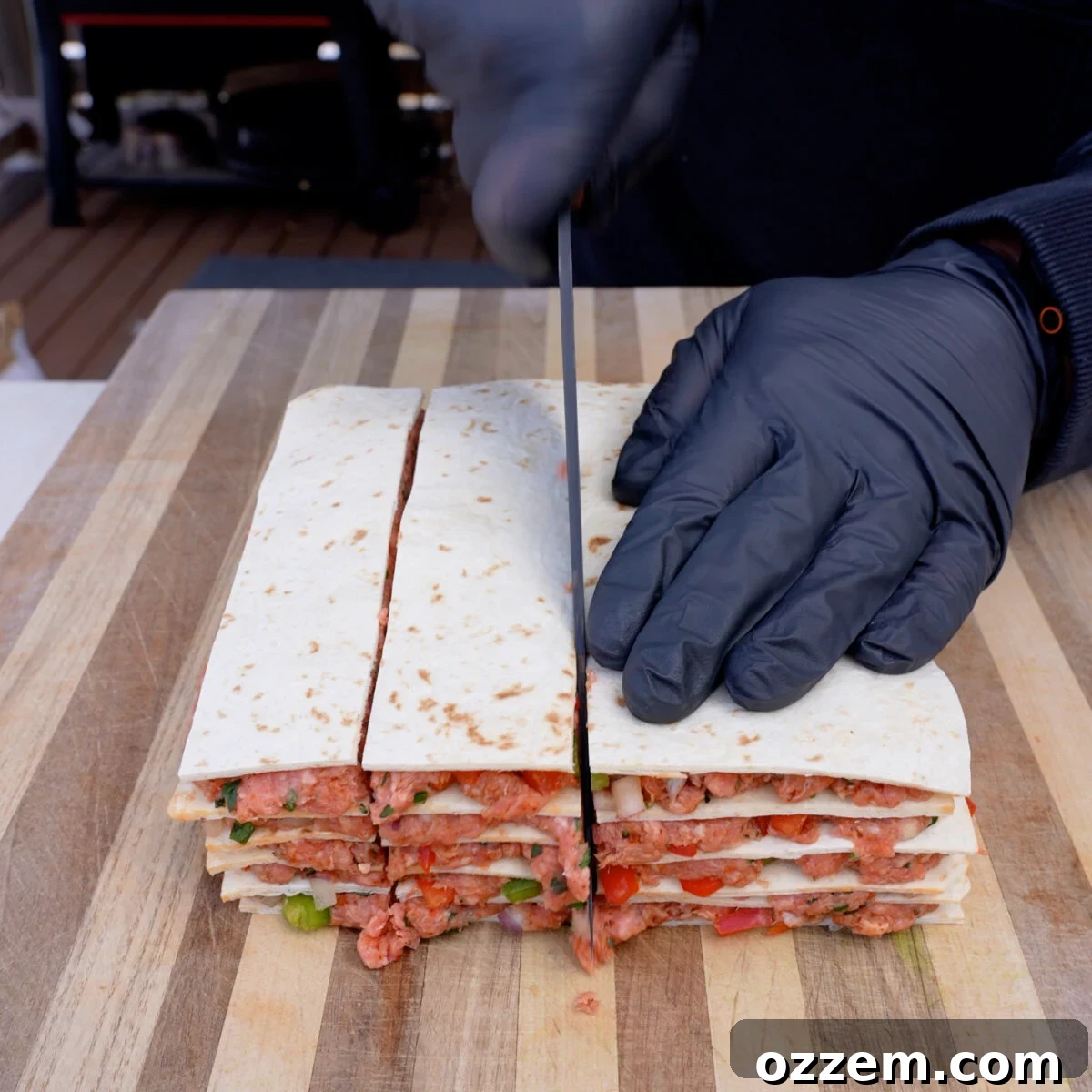 Tortillas and beef mix layered.