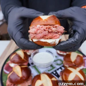 Gourmet Prime Rib Sliders 12 Appetizing Grilled Prime Rib Sliders presented on a serving board.