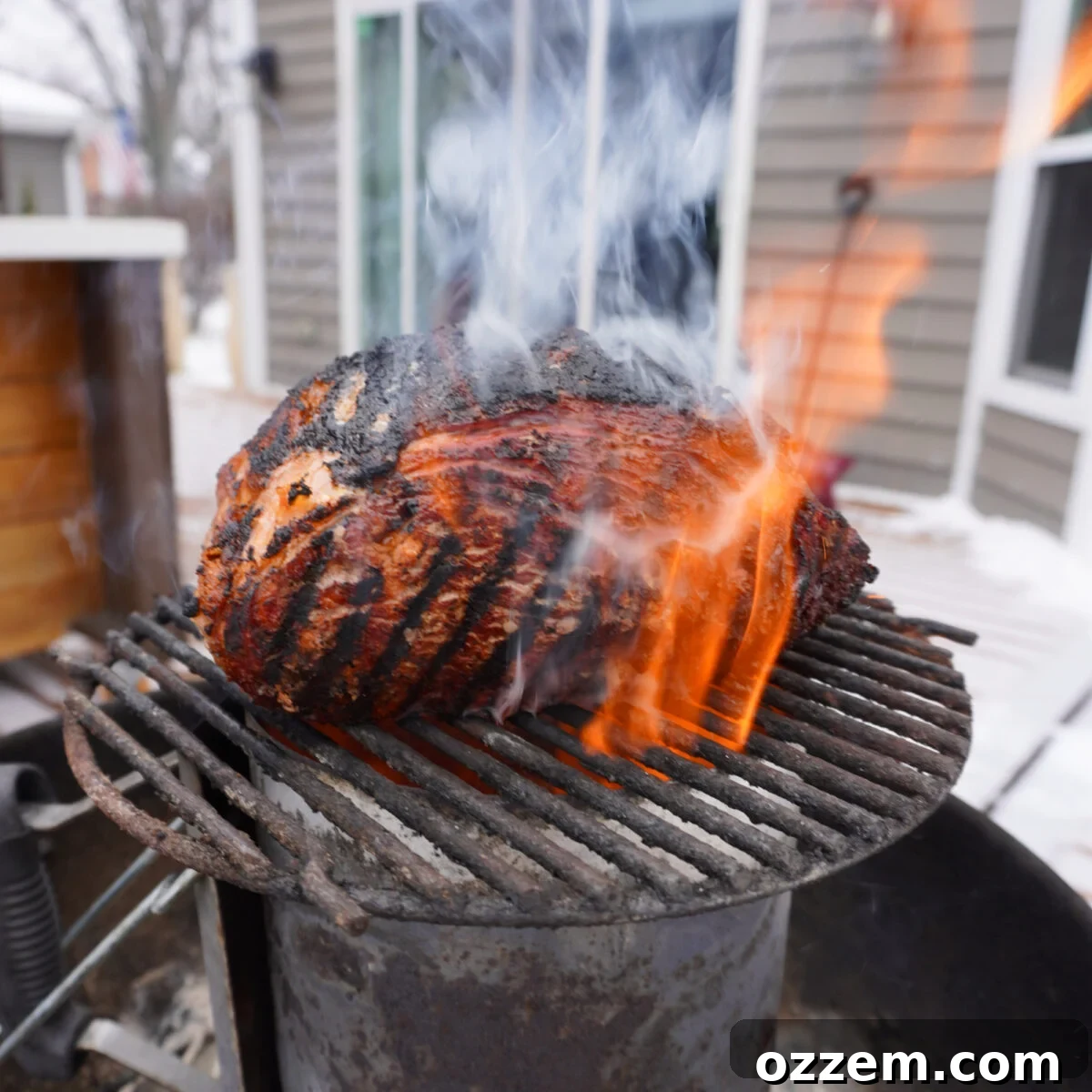 Gourmet Prime Rib Sliders 8 A perfectly reverse-seared prime rib on a small grate over a lit chimney starter, creating an intense, direct heat for a crispy crust.