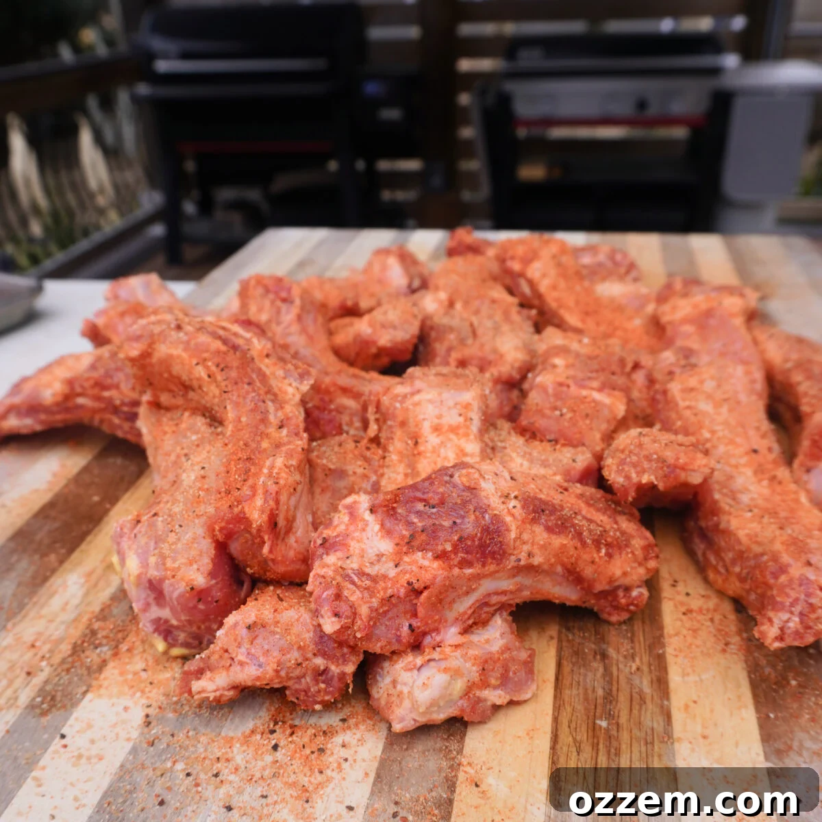 Ultimate Chili Crunch Ribs 5 Close-up of individual party ribs, perfectly seasoned and ready for the smoker.