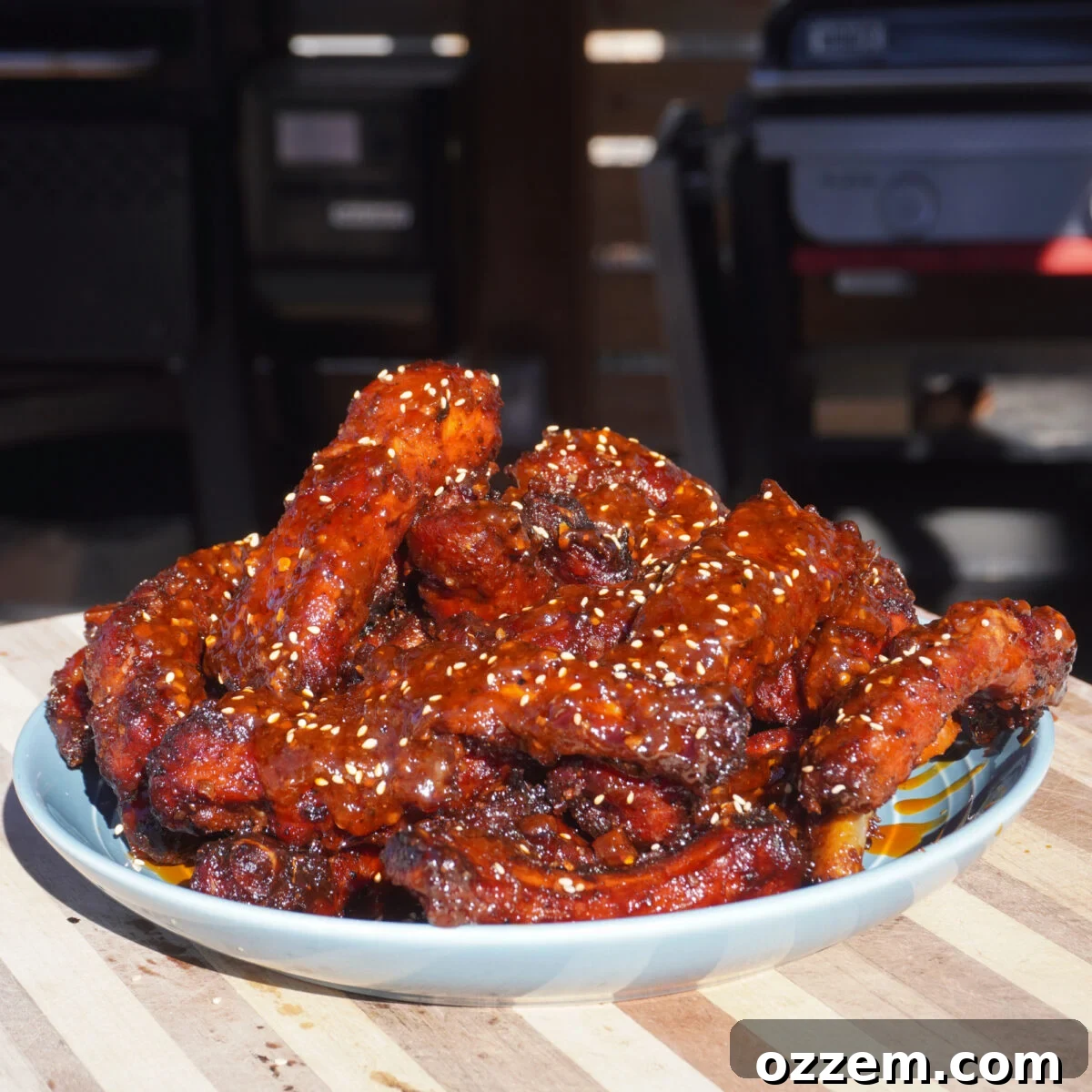 Ultimate Chili Crunch Ribs 9 Chili Crunch Party Ribs beautifully plated, garnished with sesame seeds and herbs.