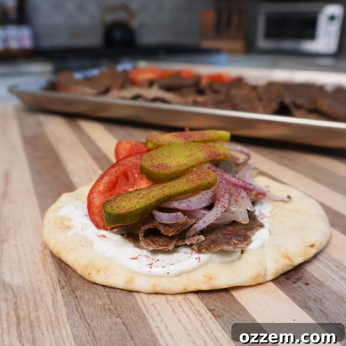 A cutting board laden with beautifully presented Sheet Pan Beef Kebabs, ready to be served, highlighting their appetizing appearance.