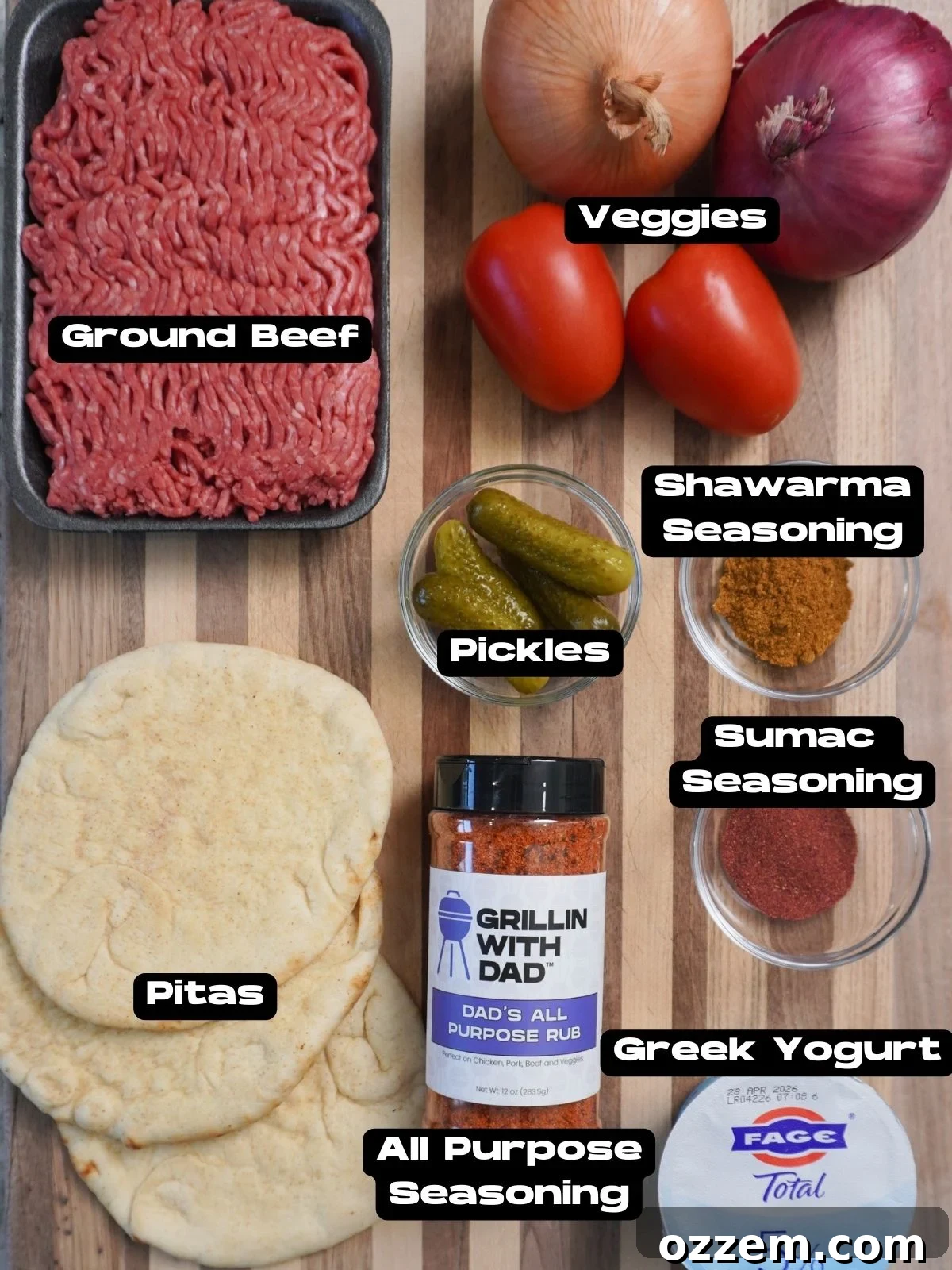 A vibrant collection of fresh ingredients laid out, ready for making Sheet Pan Beef Kebabs, including ground beef, onions, parsley, tomatoes, and spices.