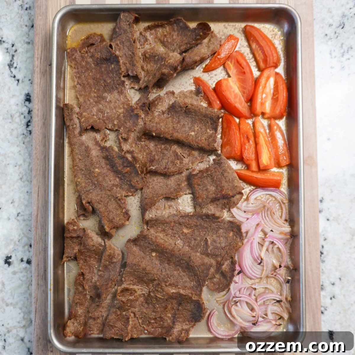 Close-up of ground beef kebabs after being broiled, showing crispy edges and a rich, golden-brown color.