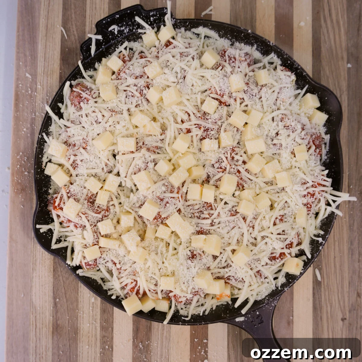 cheese covered cast iron skillet.