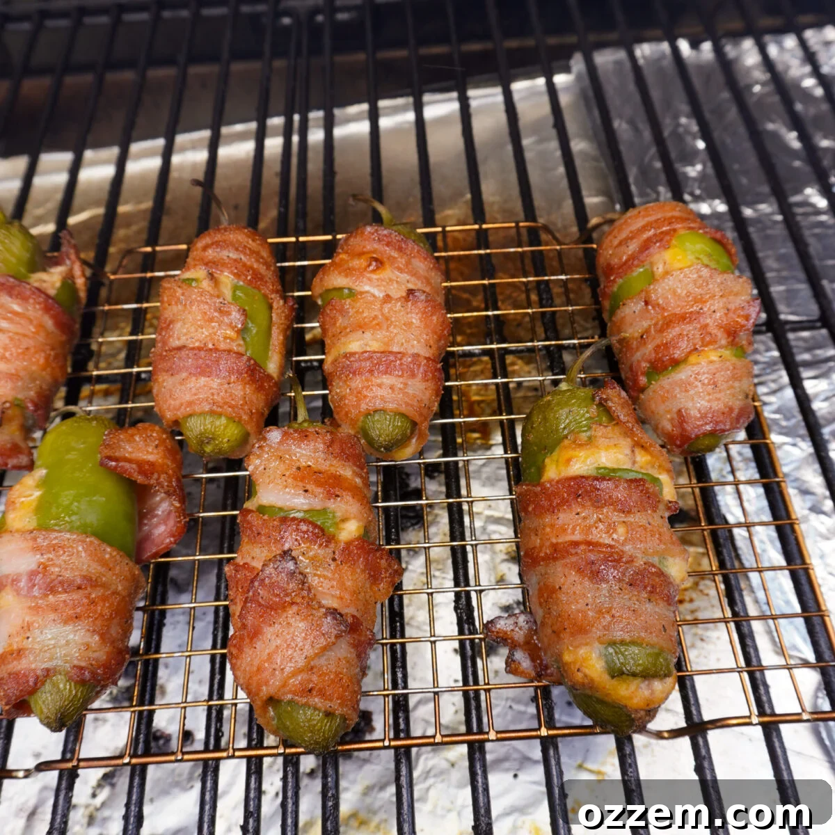 Pulled Pork-Stuffed Jalapeño Poppers: Smoky, Cheesy Bites 8 jalapeno poppers on the grill.
