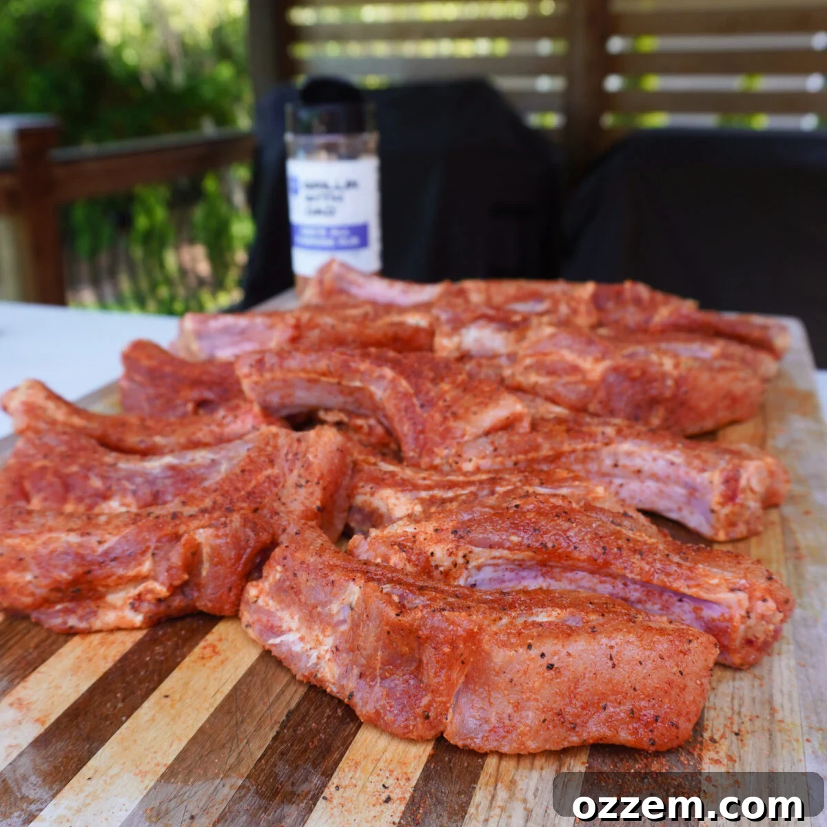 Seasoned raw party ribs.