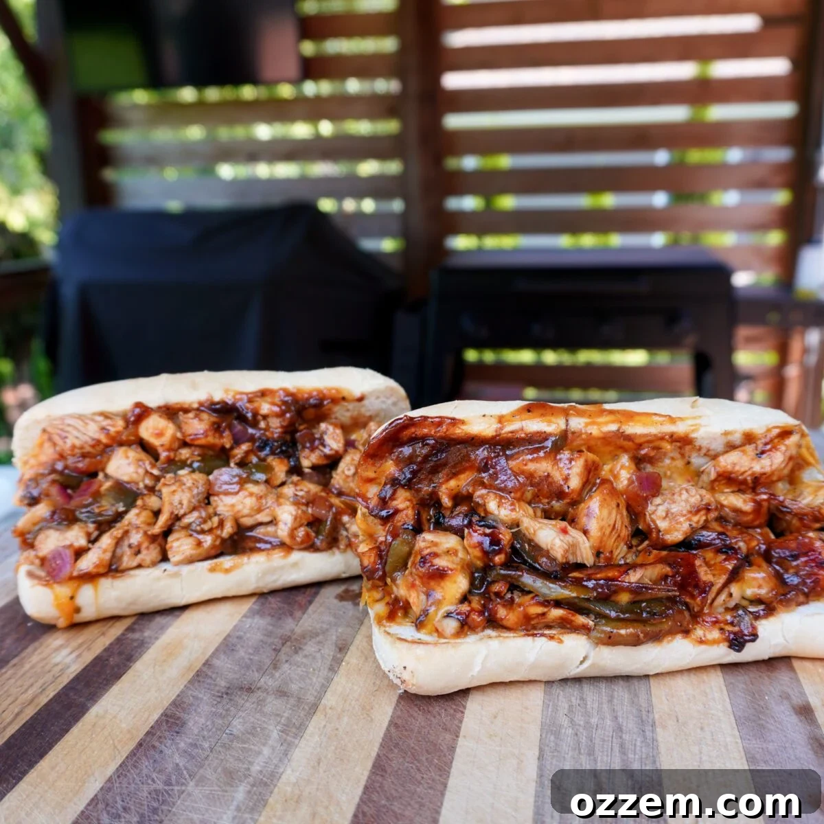 Chopped Spicy Chicken Sandwhich on wooden cutting board.