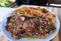 Savory Grilled Pork Steaks with Garlic and Herb Marinade