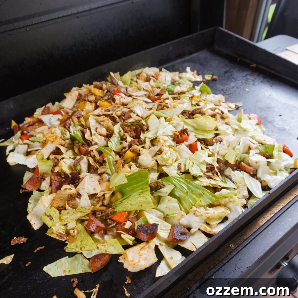 Sauteed veggies mixed in with the protein for the Grilled Dirty Cabbage recipe.