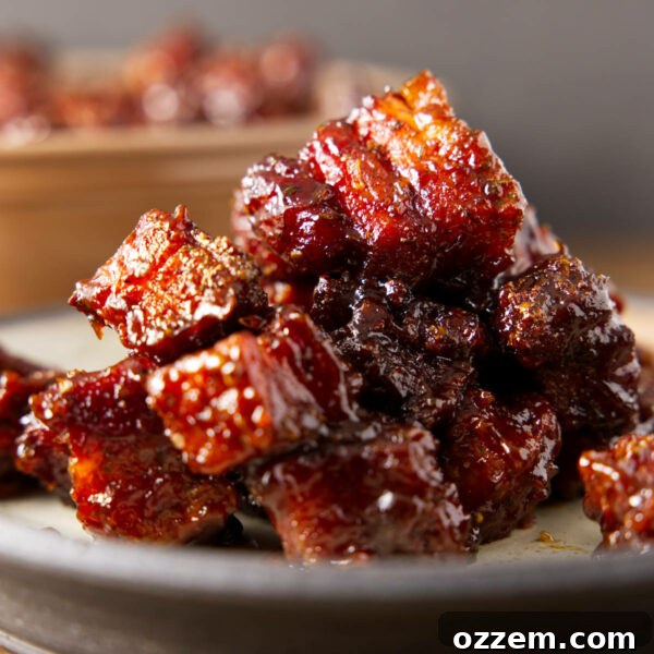 Pile of pork belly burnt ends on a plate.