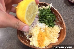 Smoky Pellet Grill Salmon Recipe 10 Squeezing lemon juice in to compound butter mixture in a wooden bowl.