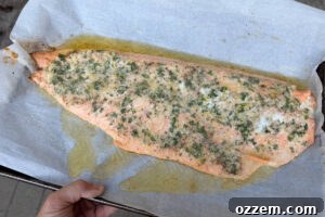 Smoky Pellet Grill Salmon Recipe 13 Removing salmon fillet from the grill on a sheet pan.