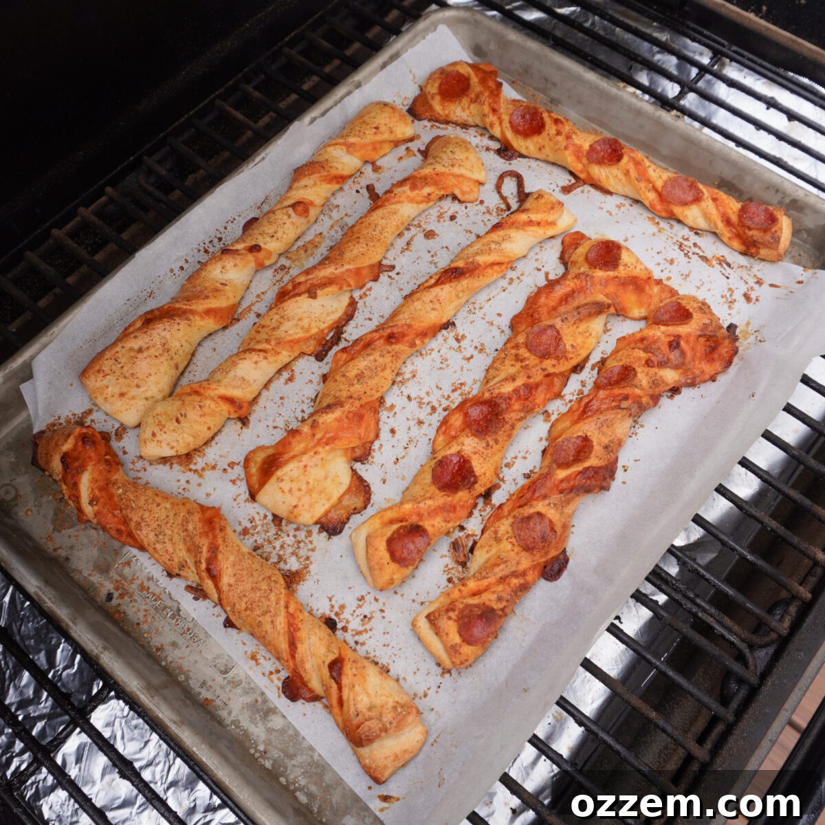 Homemade Cheesy Pizza Twist Sticks 7 Pizza stick twists on the grill.